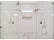 Contemporary glass-enclosed shower with dual rainfall shower heads and stylish pebble flooring at 6900 Driskell Cir, Cumming, GA 30041