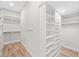Spacious walk-in closet with built-in shelving and ample storage space at 6900 Driskell Cir, Cumming, GA 30041