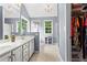 Bright bathroom with double vanity, soaking tub, linen closet and walk-in closet at 10 Callaway Ct, Hiram, GA 30141