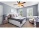 Bedroom with a ceiling fan, neutral walls, and two windows at 10 Callaway Ct, Hiram, GA 30141