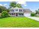 Charming two-story home with a welcoming front porch and well-manicured lawn at 10 Callaway Ct, Hiram, GA 30141