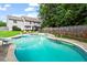 Inviting backyard pool with lounge chairs, landscaping, and a privacy fence, perfect for relaxation at 10 Callaway Ct, Hiram, GA 30141