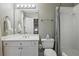 Functional bathroom highlighting a vanity with a sink, toilet, and a shower-tub combination with a neutral-patterned curtain at 1244 Harris Commons Pl, Roswell, GA 30076