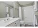 Clean bathroom showcasing a white vanity, toilet, and a bathtub with a shower featuring white tile surround and a shower curtain at 1244 Harris Commons Pl, Roswell, GA 30076