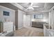 Bedroom with gray walls, featuring a crib and dresser with a changing table; the room is naturally lit and cozy at 1244 Harris Commons Pl, Roswell, GA 30076