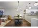 Open floorplan showcasing dining area, living room, and kitchen, complete with modern lighting and decor at 1244 Harris Commons Pl, Roswell, GA 30076