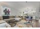 Spacious living room with view into kitchen, featuring an open layout and contemporary furnishings at 1244 Harris Commons Pl, Roswell, GA 30076
