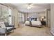 Spacious main bedroom with plush carpet, natural light, and ample space for relaxation and rest at 1244 Harris Commons Pl, Roswell, GA 30076