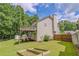 View of the home's backyard, showcasing the upper and lower decks with lush green grass at 3781 Deercreek Dr, Powder Springs, GA 30127
