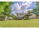 Spacious backyard with mature trees, a storage shed, and multiple deck spaces at 3781 Deercreek Dr, Powder Springs, GA 30127
