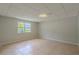 Clean basement with tile flooring, a bright window and electrical outlets at 3781 Deercreek Dr, Powder Springs, GA 30127