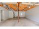 Spacious unfinished basement featuring an exposed ceiling with duct work and door to outside at 3781 Deercreek Dr, Powder Springs, GA 30127