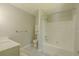 Bathroom showcasing a bathtub, toilet, sink with vanity, gray tile floor, and gray walls at 3781 Deercreek Dr, Powder Springs, GA 30127