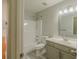 Bathroom featuring a shower-tub, sink with vanity and neutral wall color at 3781 Deercreek Dr, Powder Springs, GA 30127