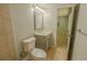 Bathroom includes a tiled shower, toilet, and vanity with a mirror and a view to the next room at 3781 Deercreek Dr, Powder Springs, GA 30127