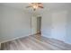 Bright bedroom featuring a ceiling fan, gray walls, and two doors at 3781 Deercreek Dr, Powder Springs, GA 30127
