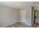 Spacious closet featuring wood floors, adjustable shelving, and gray walls at 3781 Deercreek Dr, Powder Springs, GA 30127