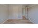 Spacious closet featuring wood floors, adjustable shelving, and gray walls at 3781 Deercreek Dr, Powder Springs, GA 30127