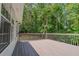 Deck overlooking the lush backyard with mature trees and a privacy fence at 3781 Deercreek Dr, Powder Springs, GA 30127