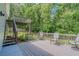 Outdoor deck area with stairs leading down to a lower tier and backyard at 3781 Deercreek Dr, Powder Springs, GA 30127
