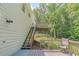 Side view of house showcasing deck area and stairs leading to the backyard at 3781 Deercreek Dr, Powder Springs, GA 30127