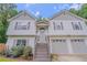 Charming two-story home with a two-car garage, landscaped front yard, and inviting entryway at 3781 Deercreek Dr, Powder Springs, GA 30127