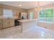 Charming kitchen with stainless steel appliances, granite countertops, and breakfast bar at 3781 Deercreek Dr, Powder Springs, GA 30127