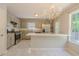 Charming kitchen with stainless steel appliances, granite countertops, and breakfast bar at 3781 Deercreek Dr, Powder Springs, GA 30127