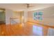 Open living room with hardwood floors, paneled walls, and natural light, leading to other living spaces at 3781 Deercreek Dr, Powder Springs, GA 30127