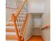 View of a beautiful wooden staircase with iron spindles at 3781 Deercreek Dr, Powder Springs, GA 30127