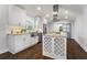 Modern kitchen with white cabinets, stainless steel appliances, granite countertops, and hardwood floors at 4178 Castle Pines Ct, Tucker, GA 30084