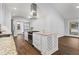 Well-equipped kitchen with stainless steel appliances, hardwood floors, granite counters, and an island at 4178 Castle Pines Ct, Tucker, GA 30084