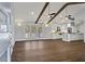 Open-concept living space with hardwood floors flowing into a modern kitchen, perfect for entertaining at 4178 Castle Pines Ct, Tucker, GA 30084