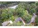 Stunning aerial view of the property showcasing its lush surroundings and proximity to the lake at 1587 Red Fox Sw Run, Lilburn, GA 30047