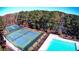 Aerial view of the tennis courts and pool at 1587 Red Fox Sw Run, Lilburn, GA 30047