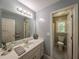 Modern bathroom featuring neutral paint, updated lighting, and separate toilet room at 1587 Red Fox Sw Run, Lilburn, GA 30047