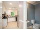 Cozy, well-lit kitchen next to a half-bath, complete with toilet and sink at 1587 Red Fox Sw Run, Lilburn, GA 30047