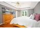 Bedroom boasts natural light, decorative ceiling fan and detailed ceiling trim at 1587 Red Fox Sw Run, Lilburn, GA 30047