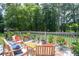 Comfortable outdoor seating on the back deck overlooking the lush green backyard at 1587 Red Fox Sw Run, Lilburn, GA 30047