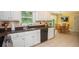 Bright kitchen featuring granite countertops and a view to the breakfast nook at 1587 Red Fox Sw Run, Lilburn, GA 30047