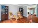 Cozy living room with hardwood floors and two leather reclining chairs at 1587 Red Fox Sw Run, Lilburn, GA 30047