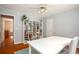 Home office with hardwood floors, built-in shelving, and natural light at 1587 Red Fox Sw Run, Lilburn, GA 30047