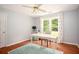 Home office with hardwood floors, neutral paint, and natural light at 1587 Red Fox Sw Run, Lilburn, GA 30047