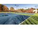 Well-maintained tennis courts with the Rivermist sign in the background, surrounded by lush greenery at 1587 Red Fox Sw Run, Lilburn, GA 30047