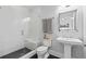 Well-lit bathroom featuring a glass enclosed shower with tiled walls, and modern fixtures at 18 Peachtree Ne Ave # 5, Atlanta, GA 30305