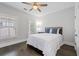 Bedroom with dark hardwood floors, natural light, and comfortable bed at 18 Peachtree Ne Ave # 5, Atlanta, GA 30305
