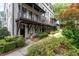 Townhome complex exterior with balconies and landscaped walkway leading to each entrance at 18 Peachtree Ne Ave # 5, Atlanta, GA 30305