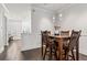 Dining room with a wooden table, seating for four, and modern pendant lighting at 18 Peachtree Ne Ave # 5, Atlanta, GA 30305