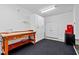 Garage with a workstation, storage cabinets, and large double doors at 18 Peachtree Ne Ave # 5, Atlanta, GA 30305
