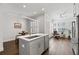 Open concept kitchen with a modern island and stainless appliances, connected to the living area at 18 Peachtree Ne Ave # 5, Atlanta, GA 30305